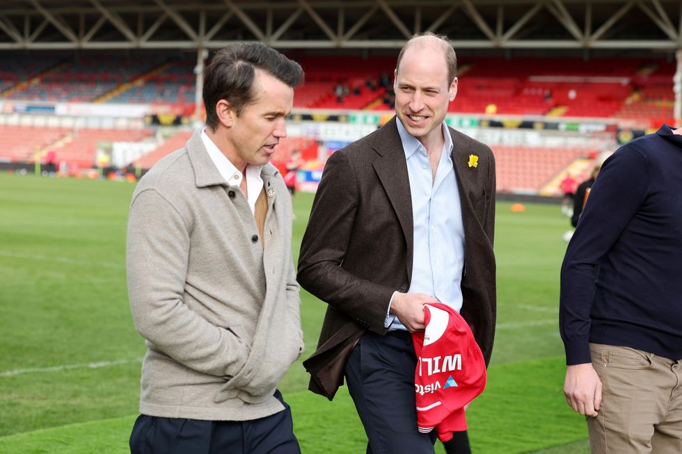 William downs shot and pulls pint during Wrexham football club visit