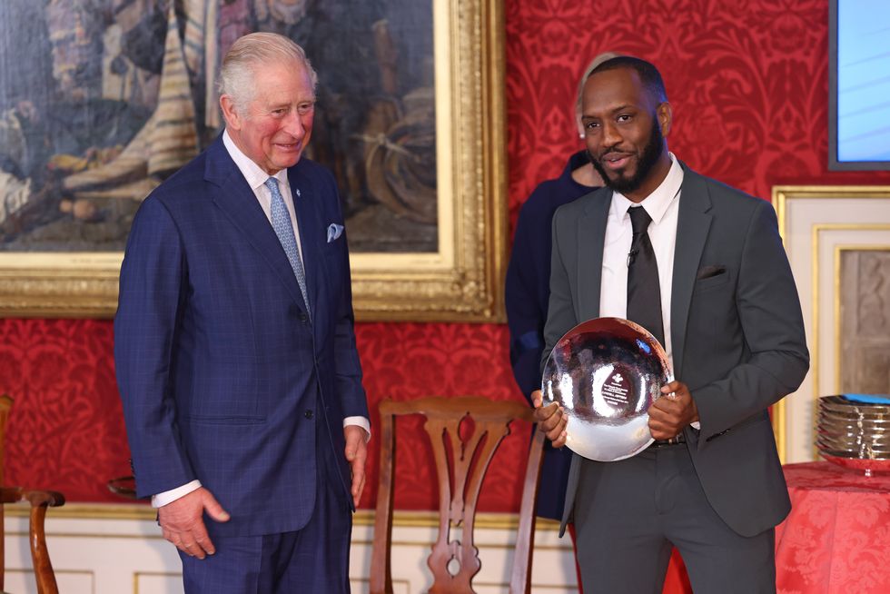 The prince presents Cordell Jeffers with his award (Tim P. Whitby/PA)