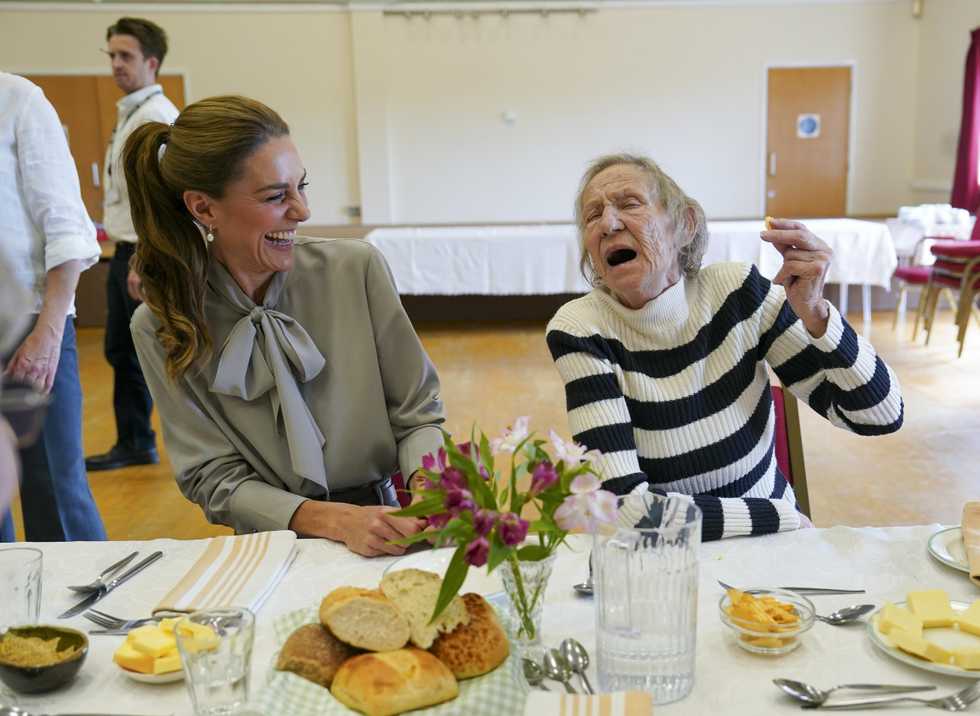 Crisps and kerb-jumping as Kate joins village hall group for lunch