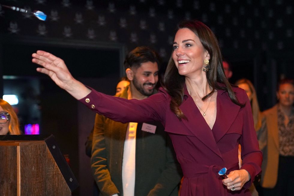 William and Kate take to the oche at pub’s underground darts bar