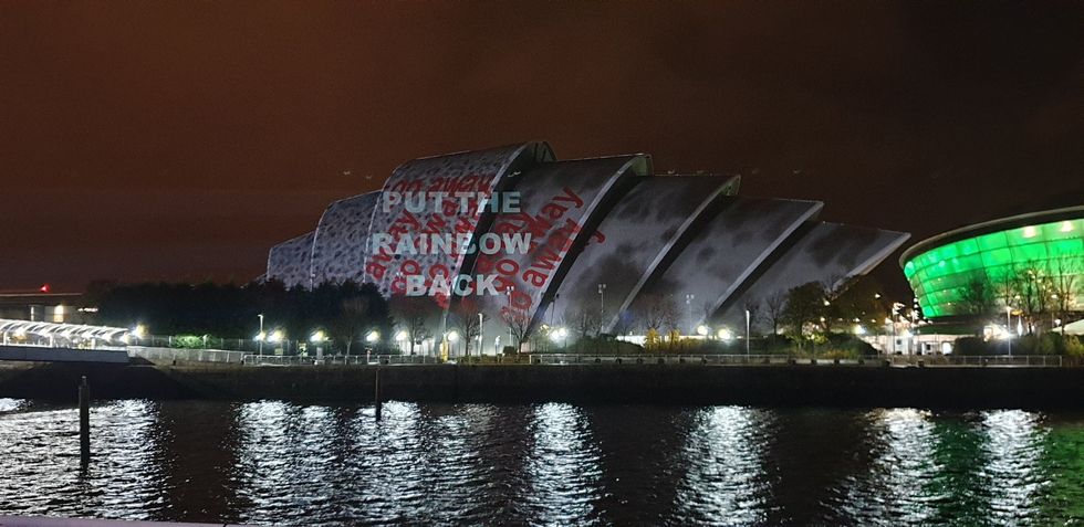 The projector operators tried to obscure the activists \u2018put the rainbow back\u2019 message (Graeme Eddolls/PA)