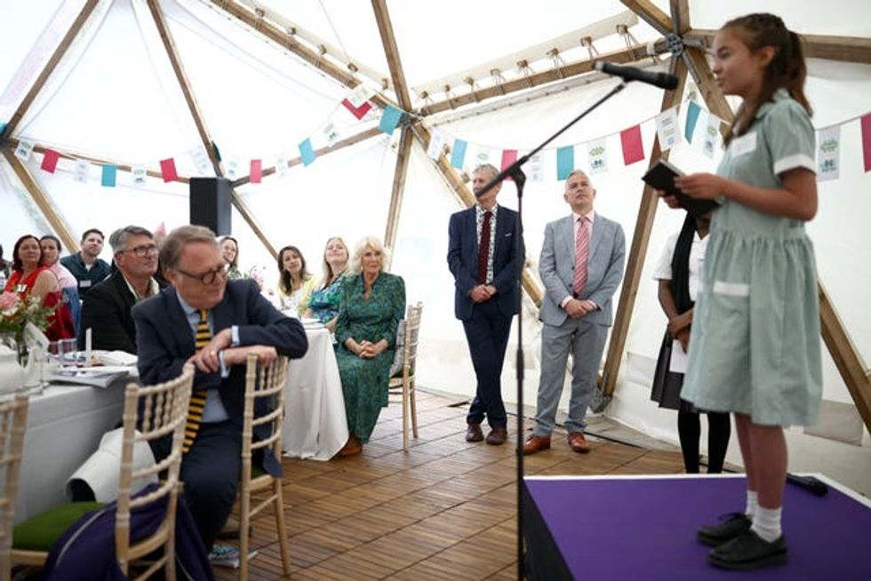 The Queen listens to Young Poet Laureate Maya