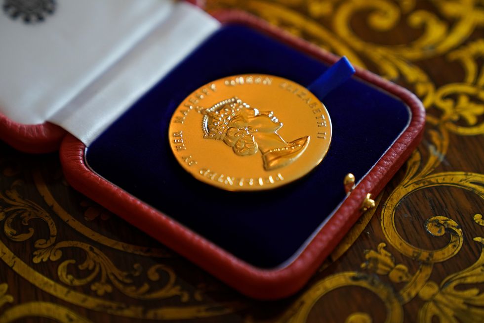 The Queen said the Queen\u2019s Gold Medal for Poetry, which was presented to David Constantine, was \u2018rather a nice medal\u2019 (Kirsty O\u2019Connor/PA)