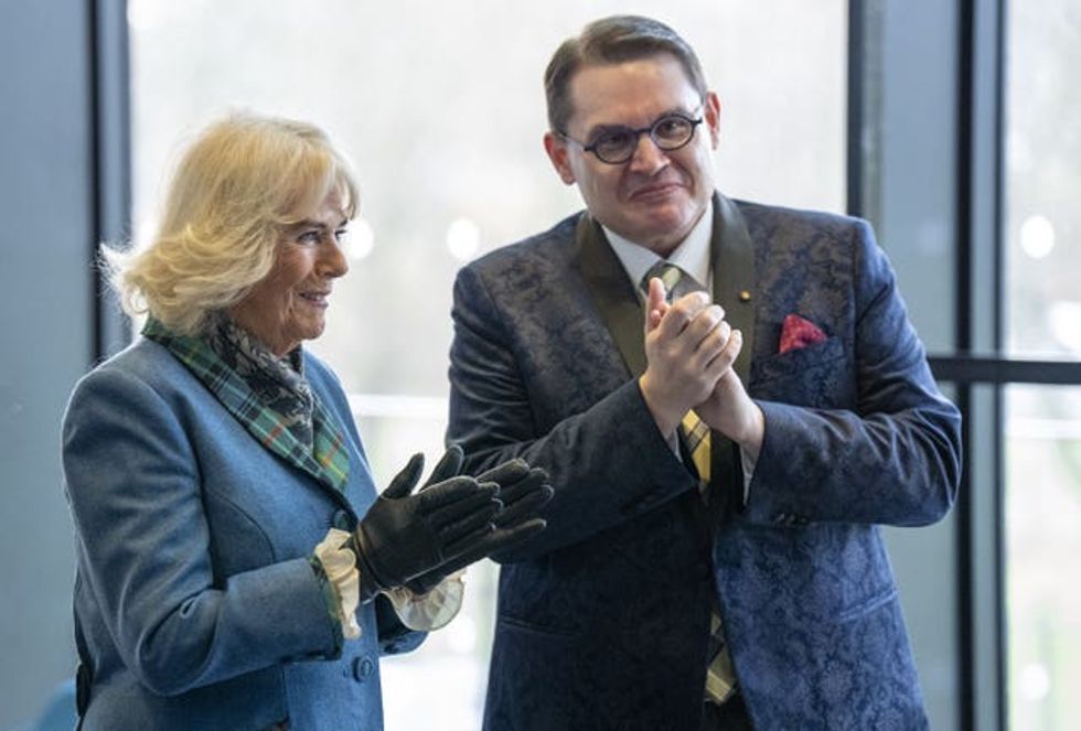 The Queen with Professor Paul Mealor, applauding a performance by the university chapel choir