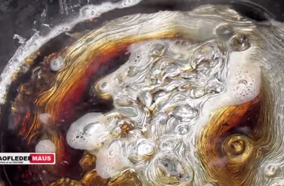 The reaction between molten lead and Coca Cola, as filmed by Taofledermaus