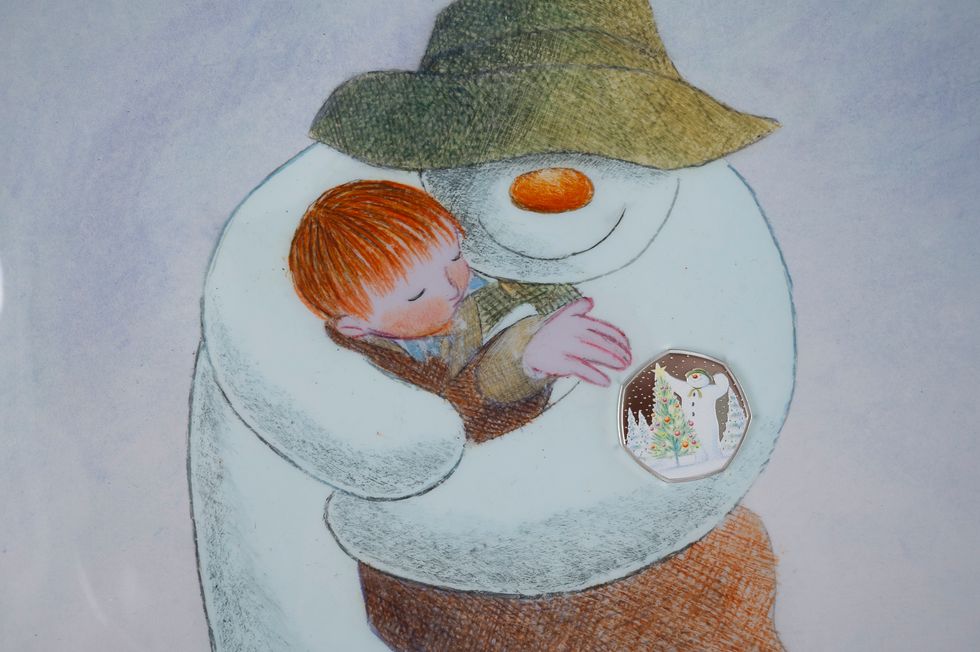 The Snowman illustration and coin