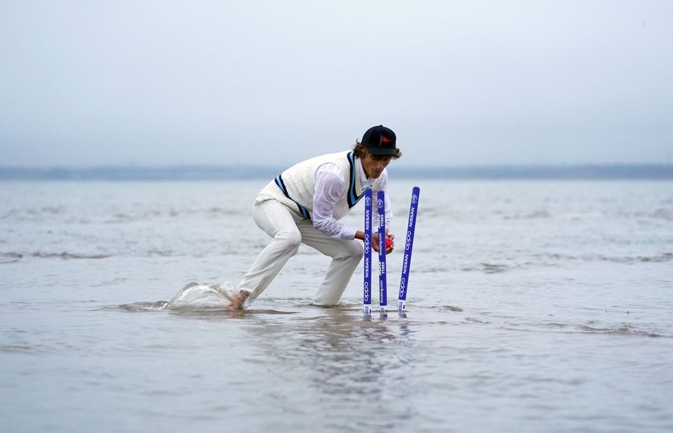 The stumps are broken as they start to submerge (Andrew Matthews/PA)