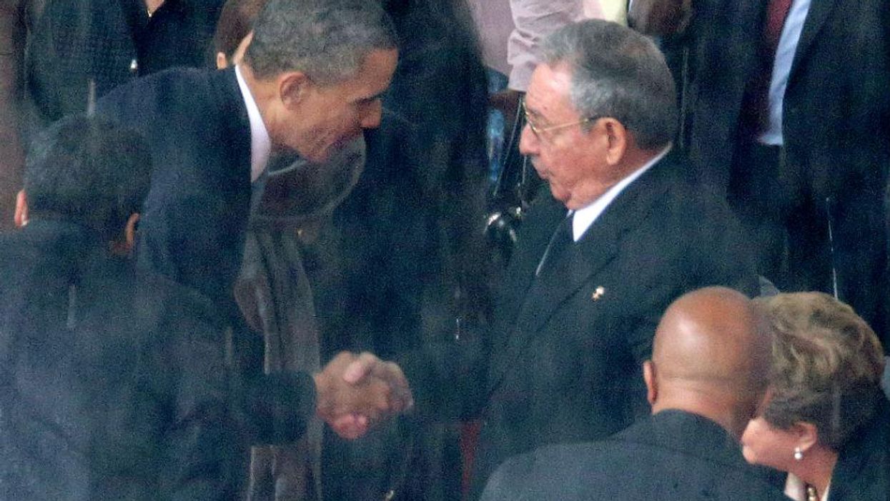 The US and Cuban presidents shake hands at Nelson Mandela's funeral last year - the first such gesture since 1959
