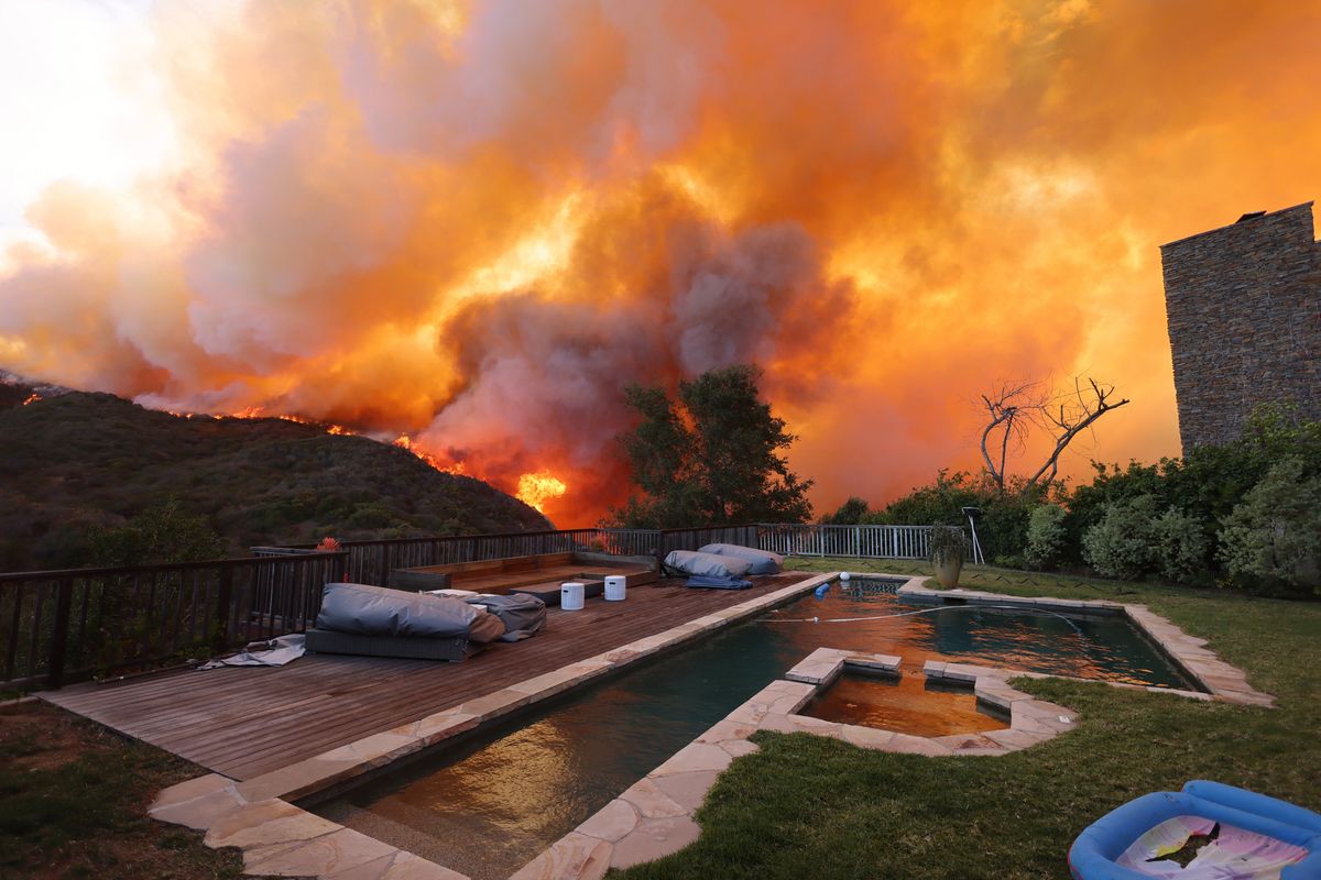 The view from a resident's pool of the Los Angeles wildfires