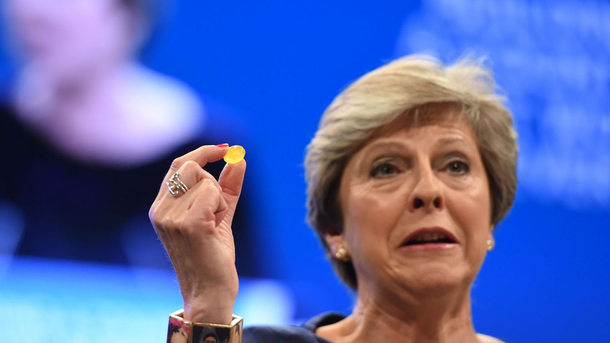 Theresa May hold's the Chancellor's cough sweet, which didn't do her much good
