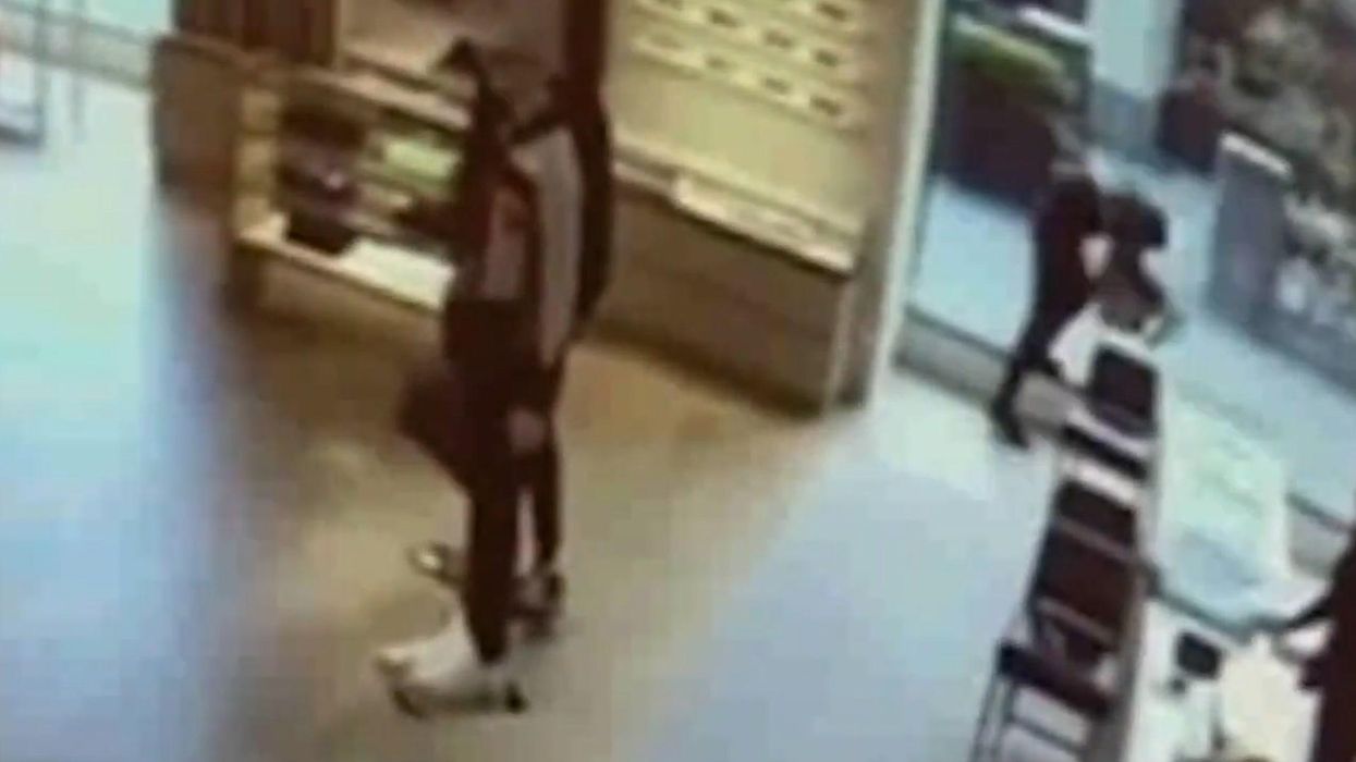 Moment thief knocks himself out trying to flee Louis Vuitton after robbery