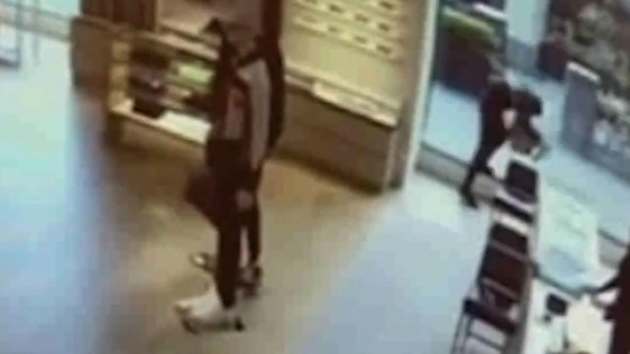 Moment thief knocks himself out trying to flee Louis Vuitton after robbery