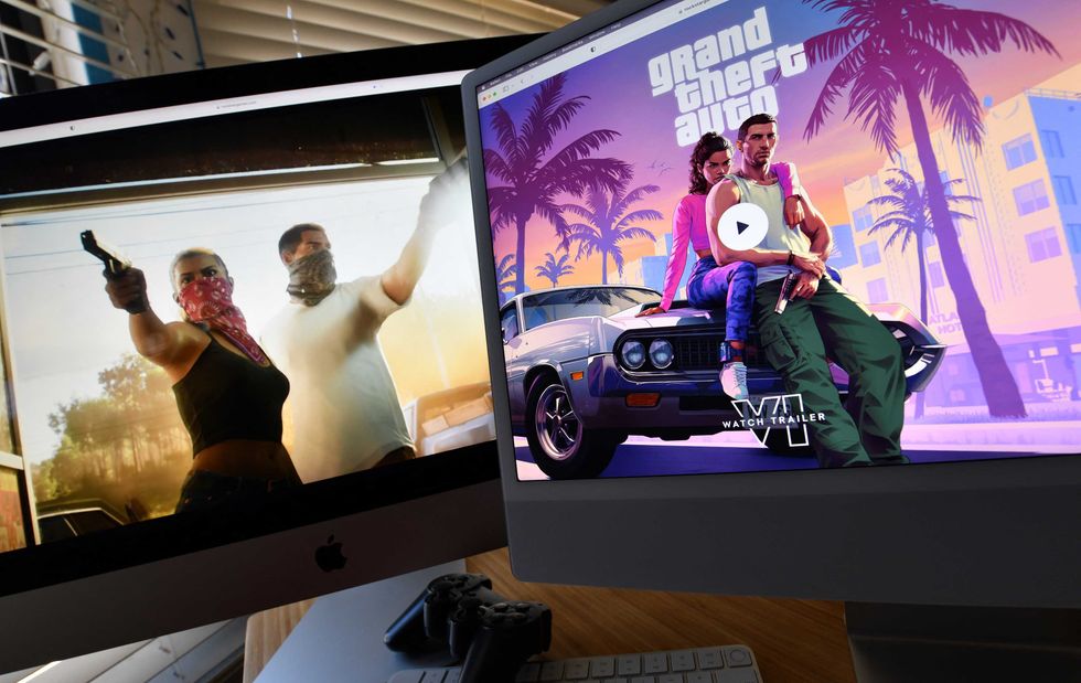 This illustration photo created in Los Angeles, California, on December 5, 2023, shows Rockstar Games' Grand Theft Auto 6 trailer played on computer screens