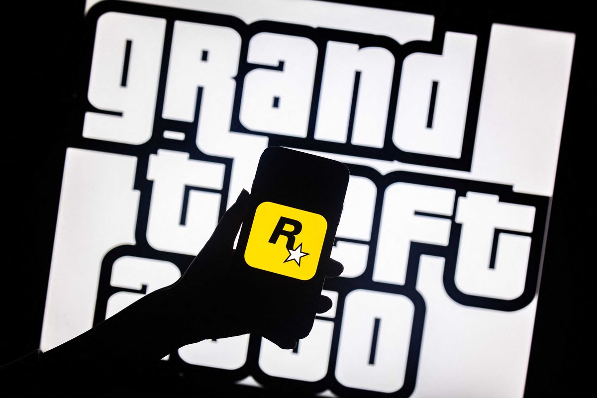 This illusttation shows a logo of Rockstar Games on a smartphone screen and a logo of a video game series Grand Theft Auto (GTA) on a TV screen in New York, November 27, 2023