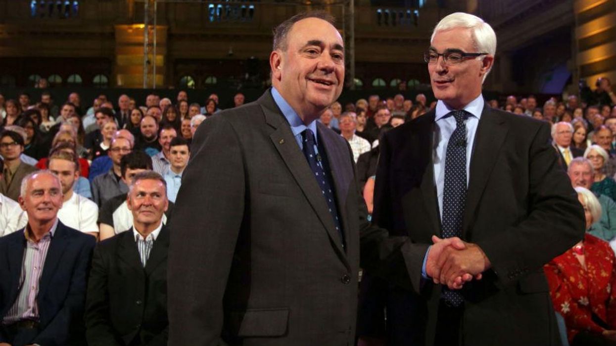 This image has been reversed to show what Alex Salmond presumably looks like when he shakes hands now (Picture: David Cheskin/AFP/Getty