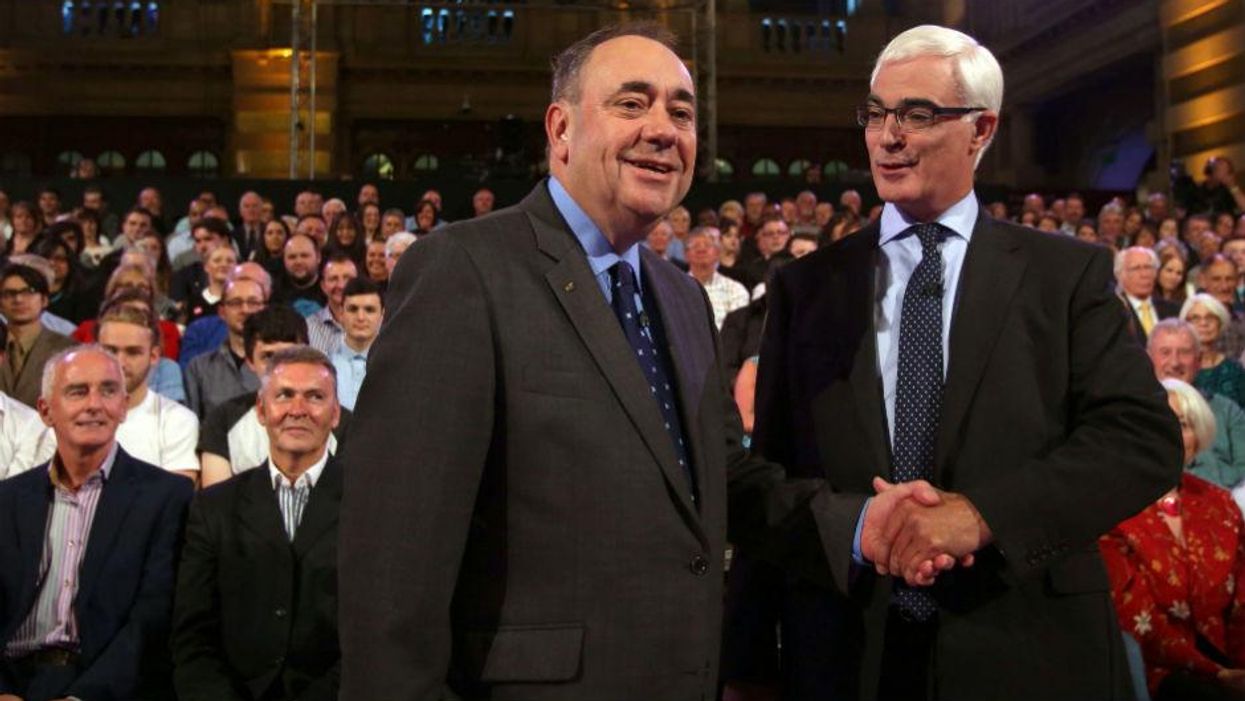 This image has been reversed to show what Alex Salmond presumably looks like when he shakes hands now (Picture: David Cheskin/AFP/Getty