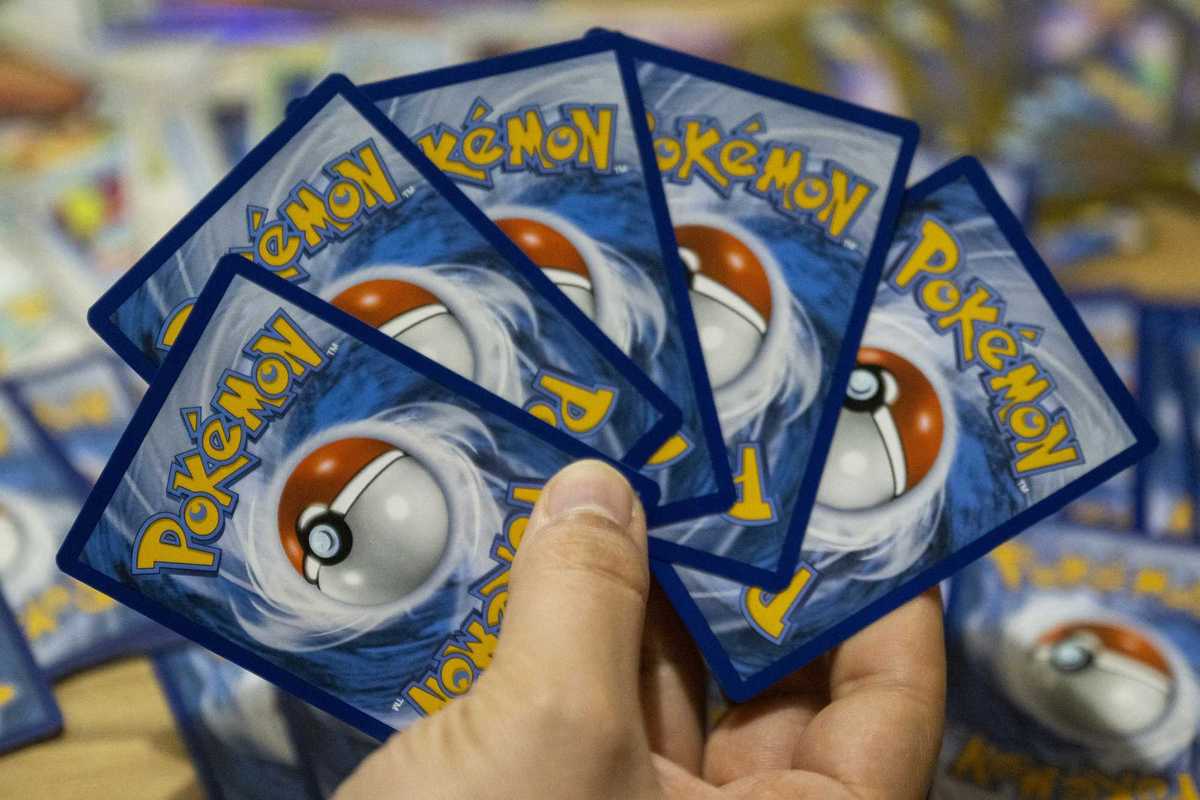 This photograph shows displayed collectible cards from the Pokemon Trading Card Game (TCG) at an amateur collector's appartment in Paris on March 11, 2026