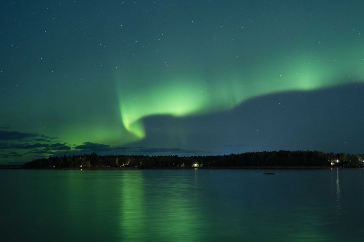 This photograph shows Northern lights (Aurora Borealis) illuminating the sky above North of Vaasa, western Finland, on October 11, 2024