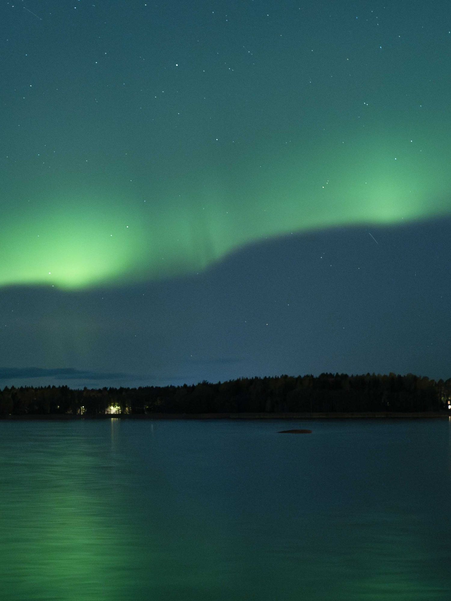 This photograph shows Northern lights (Aurora Borealis) illuminating the sky above North of Vaasa, western Finland, on October 11, 2024