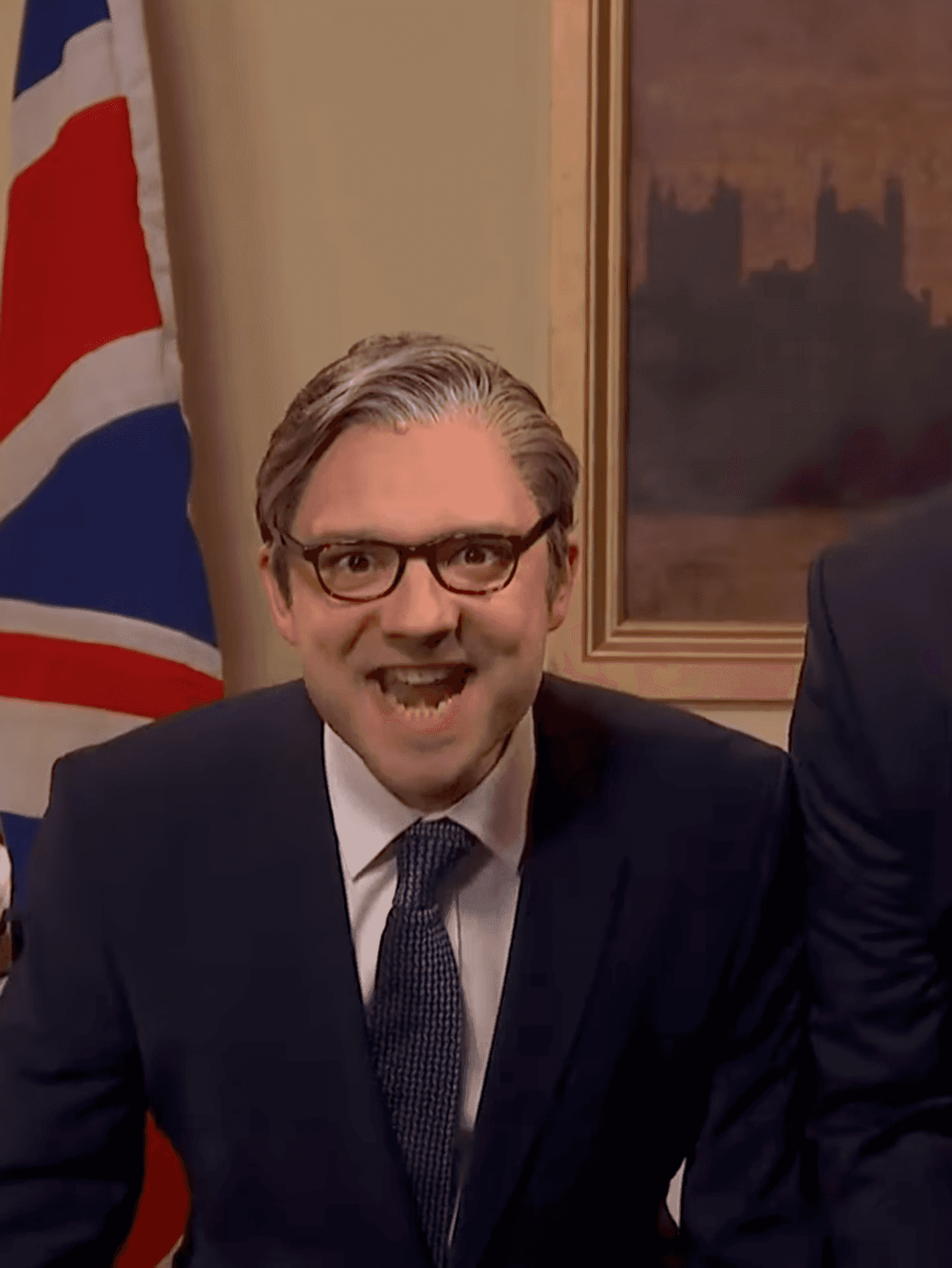 Three male actors from Saturday Night Live UK smile and shout at the camera.