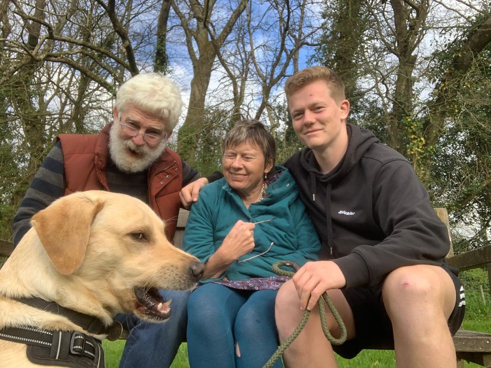 Three people and their dog