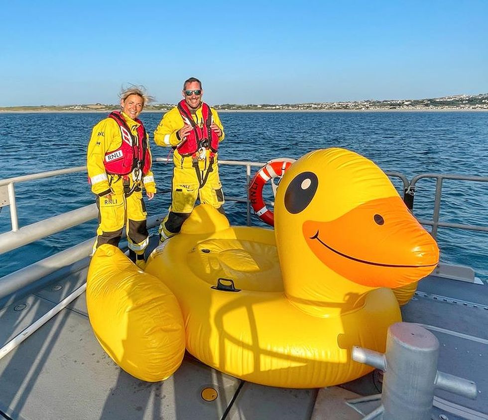 Three people rescued after giant inflatable duck drifts out to sea