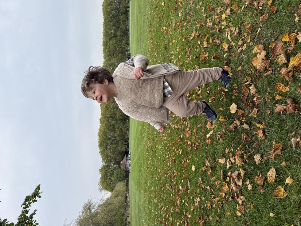 Three-year-old Nathaniel Clayton running in a park
