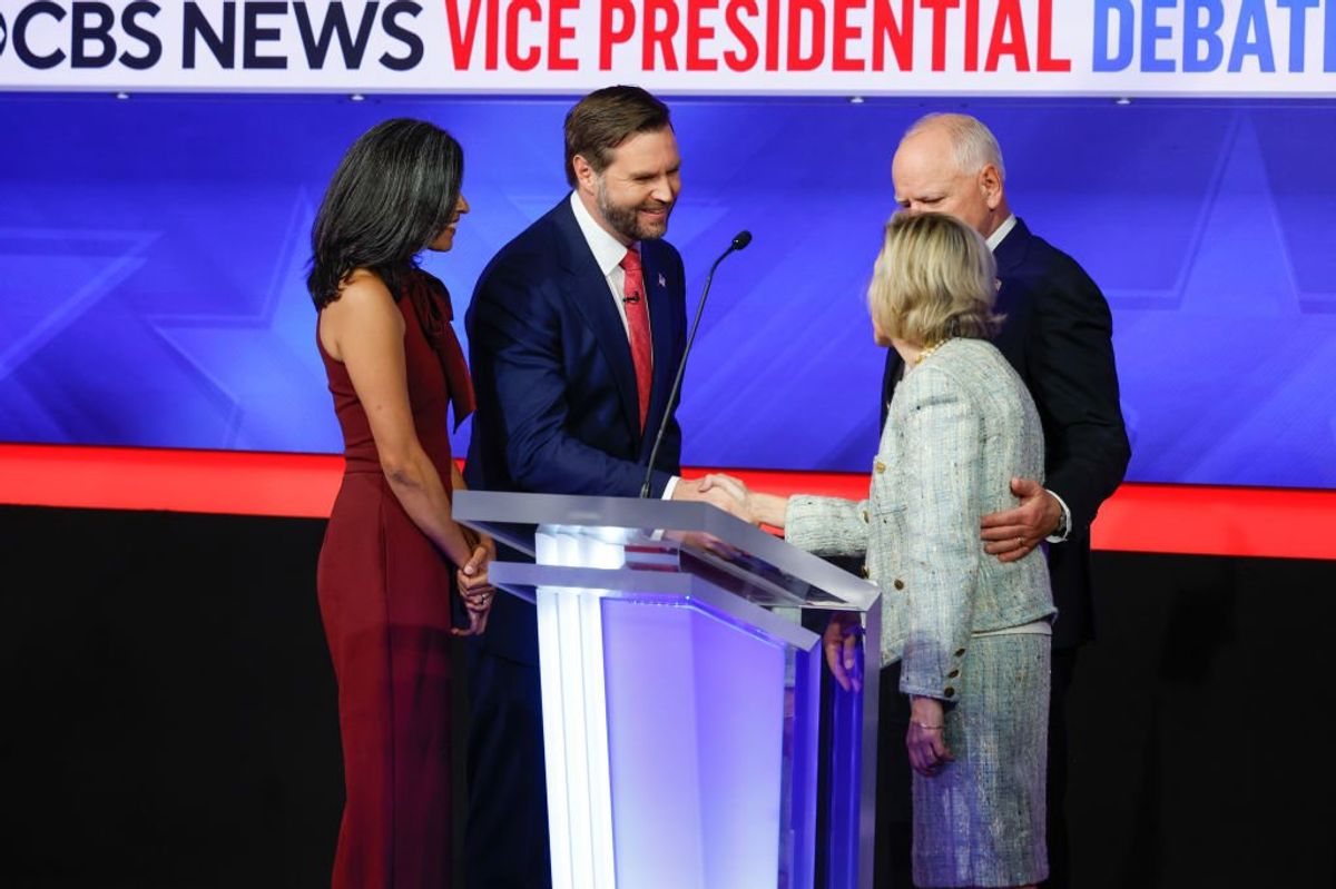 Tim Walz and his wife Gwen Walz (right) speak with JD Vance and his wife Usha Vance after a debate at the CBS Broadcast Center on October 1, 2024 in New York City