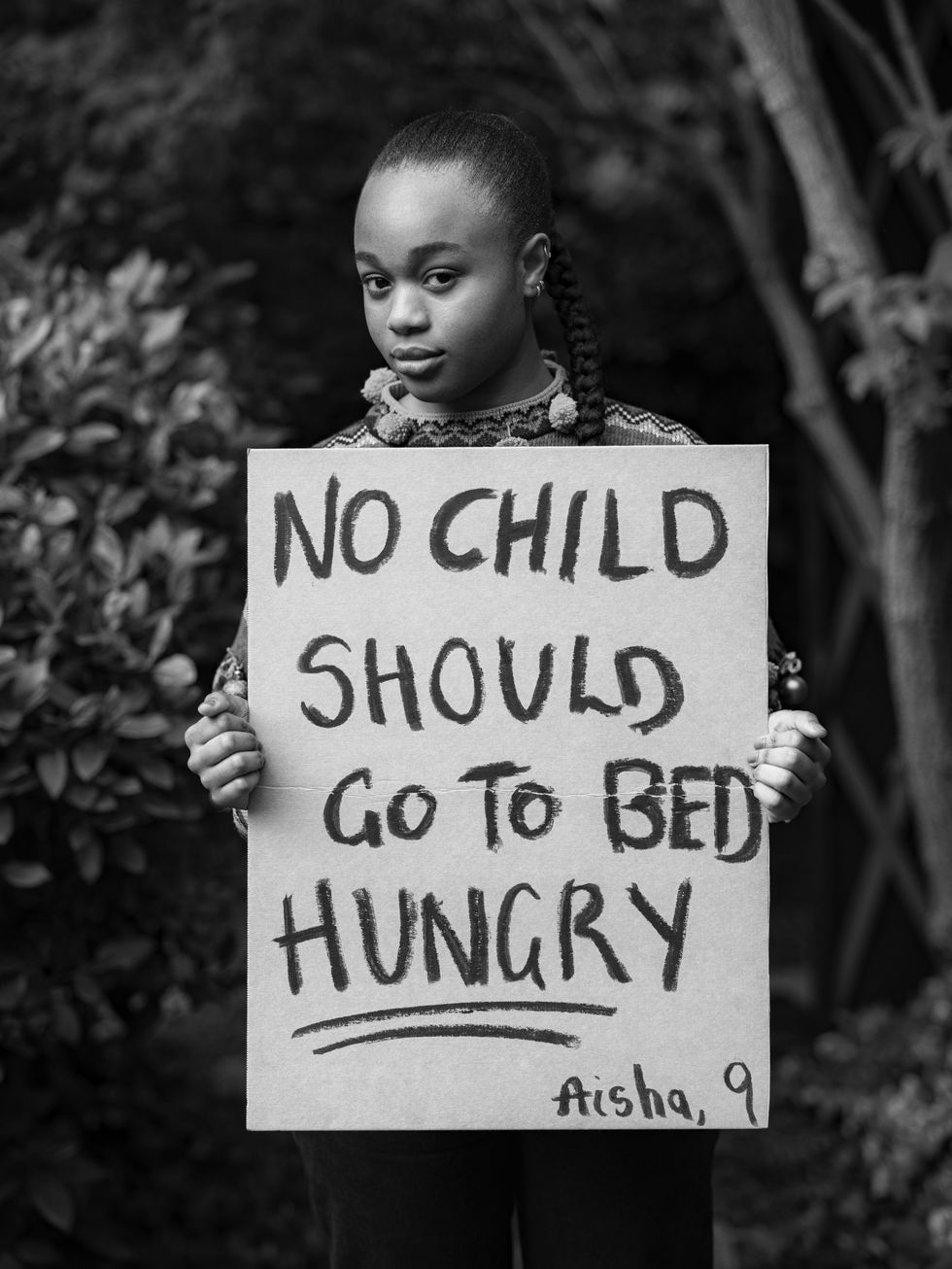 To celebrate 10 years of Save the Children\u2019s Christmas Jumper Day, famous faces from across the nation have joined forces to amplify the urgent changes that children want to see in the world.The striking images, shot by celebrated photographer Misan Harriman, connects influential names from the worlds of fashion, film and music with young people\u2019s messages of protest and hope for the future. Launching a month before Christmas, the series aims to give children from communities across the globe a platform to share the changes they want to see in the world \u2013 from reducing pollution to ending racism \u2013 and share their messages of hope for the future.Speaking of her involvement in the campaign, Bukky said: \u201cAisha has been raising money for Save the Children by giving away her Eid money, and on her placard she wrote that \u2018no child should go to bed hungry\u2019 and I agree. Food and drink aren\u2019t luxuries, they\u2019re a necessity and that\u2019s what everybody deserves. If we have people in some parts of the world that don\u2019t have that then that\u2019s a disservice on behalf of the rest of us. \u201cI think it\u2019s really important to give a voice to kids because the only difference between kids and adults is size. Yeh you grow as a person, but your essence kind of stays the same. There\u2019s a perspective we can get from kids that we can\u2019t really get from adults, the way they see the world is different. There\u2019s a lot we can learn from kids. I\u2019ve learnt a lot from Aisha from the way she gave away her Eid money so maybe I should give more of myself. \u201dTo take part, wear your favourite Christmas Jumper on 10th December and donate \u00a32 at www.christmasjumperday.org.