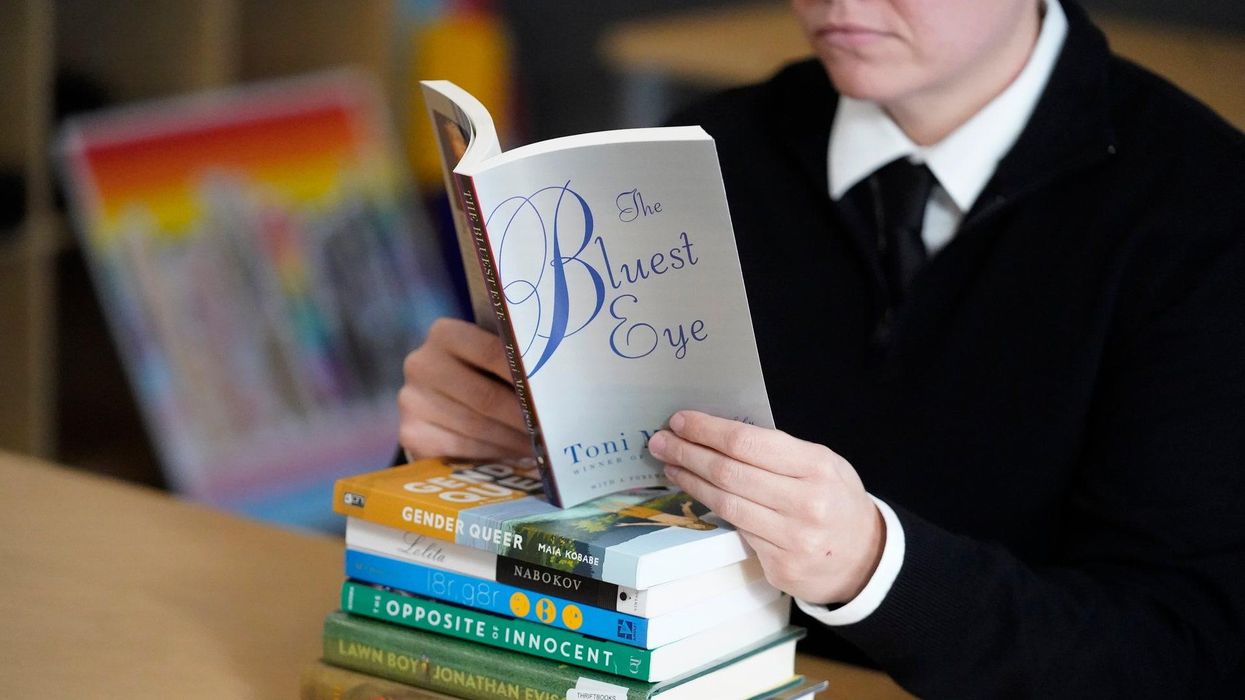 School makes librarian take down display of banned books because a parent complained