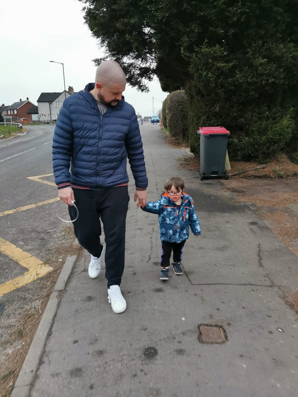 Tom Albrighton, 2, walks with his dad Andy Albrighton