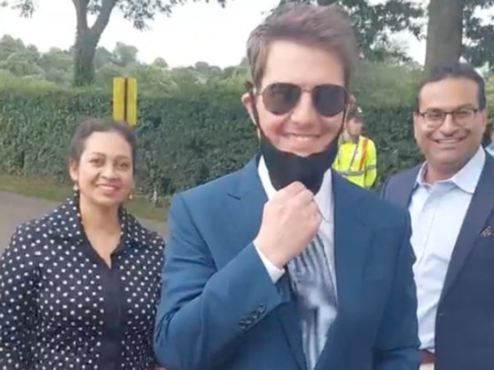 Tom Cruise poses with fans in London