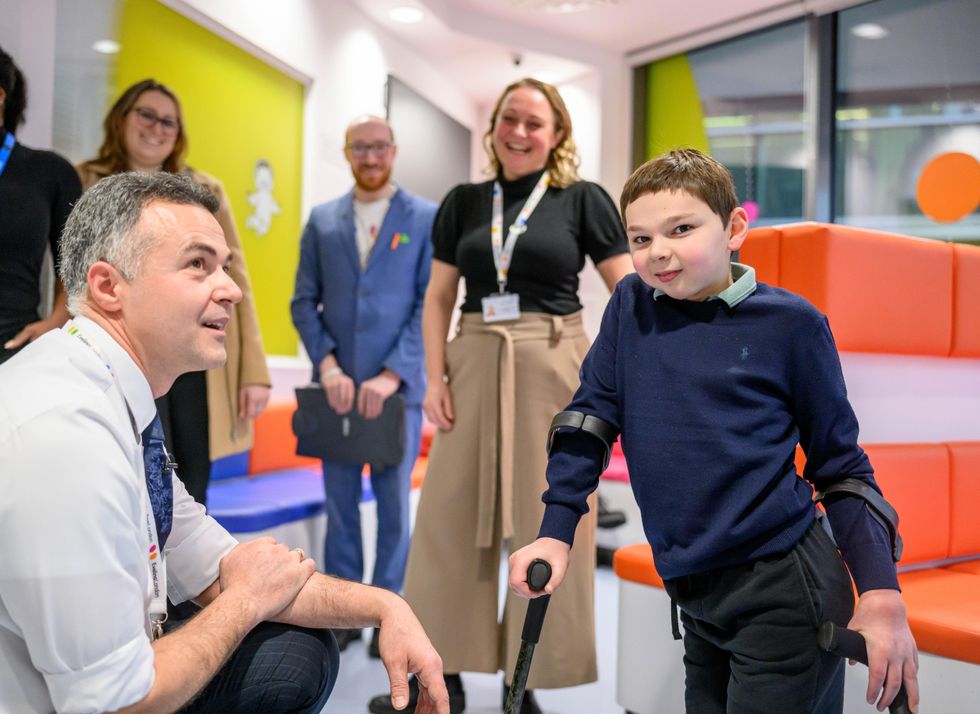 Tony Hudgell surrounded by staff members at Evelina London Children's Hospital