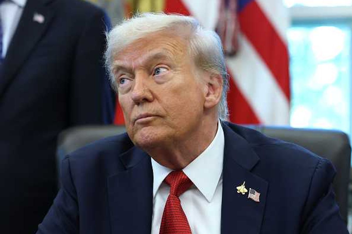 Trump in the Oval Office, looking to his right with raised eyebrows.