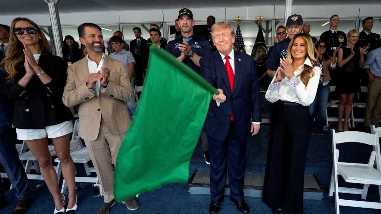 Trump mocked after being shown how to hold a flag – and waving it in the strangest way