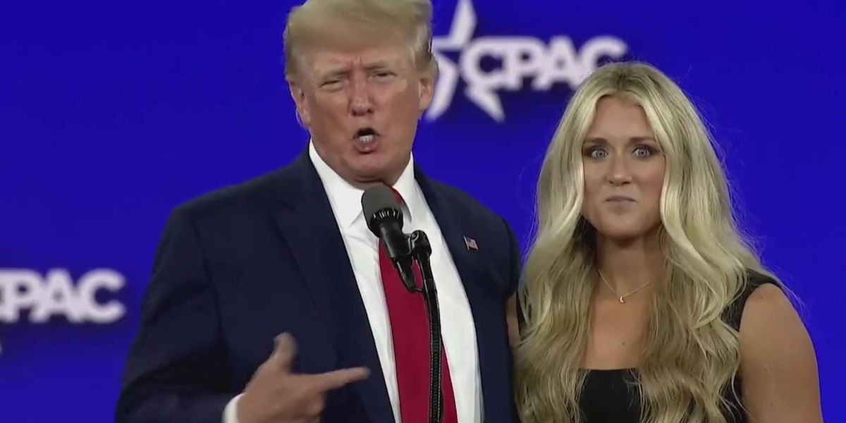 Swimmer appears to dodge Donald Trump as he tries to kiss her on stage ...
