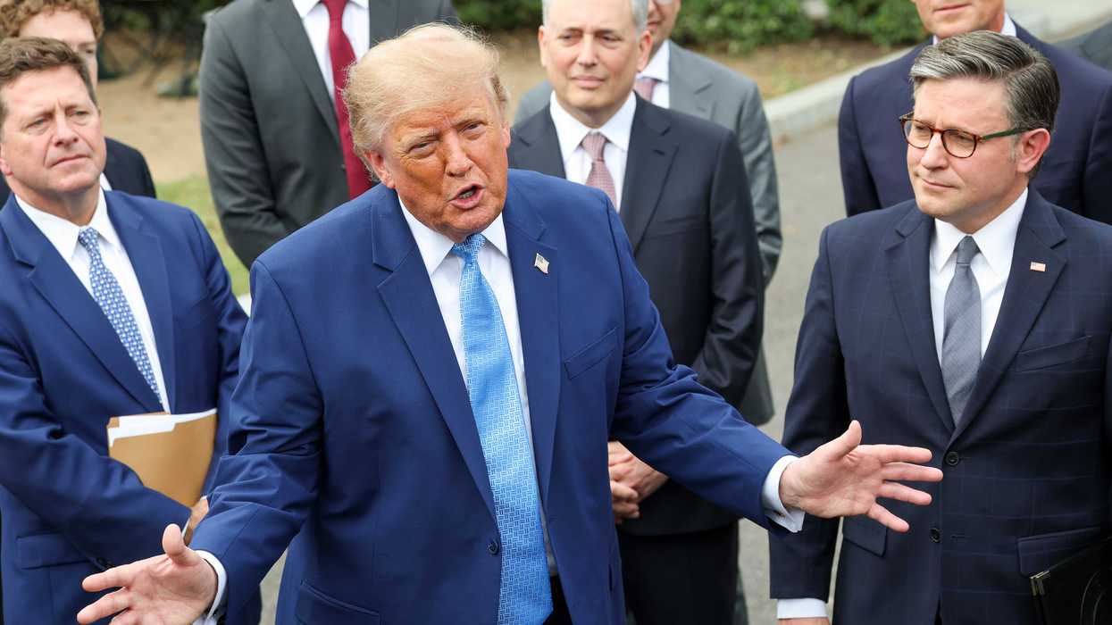 Trump speaks to reporters outside the White House while surrounded by tech CEOs.