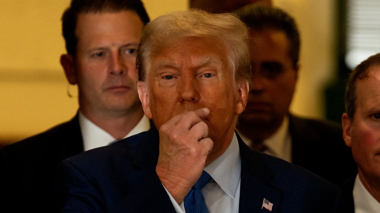 Trump responds with blunt 'zipping' gesture after chaotic scenes at court trial