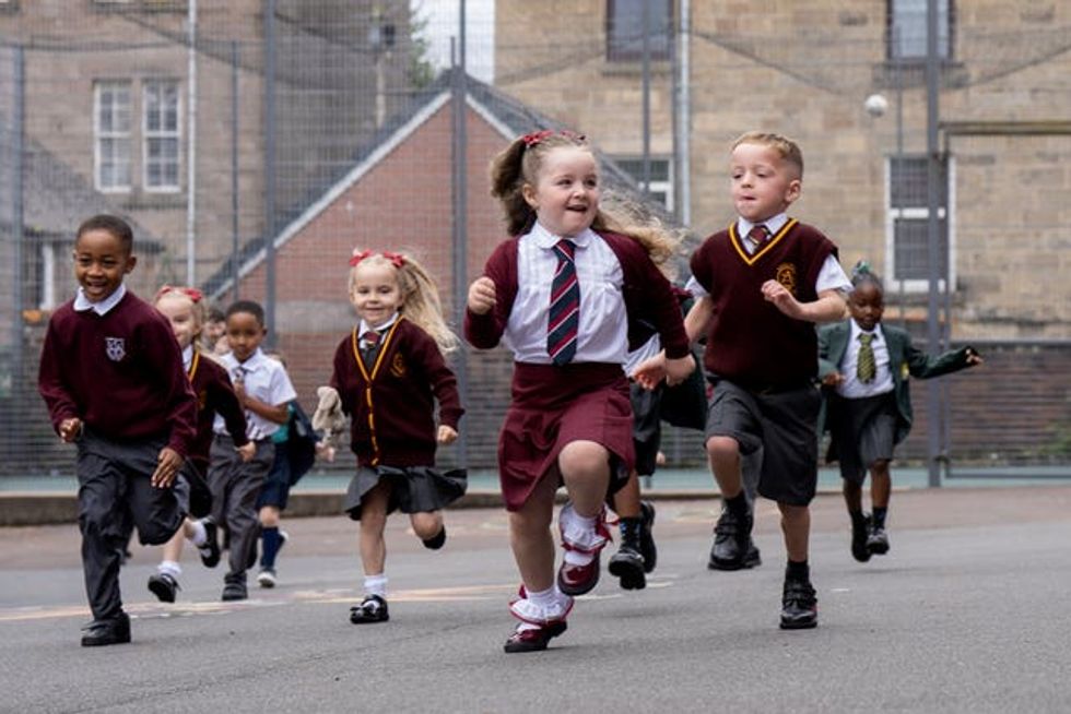 Twins running in a school playground