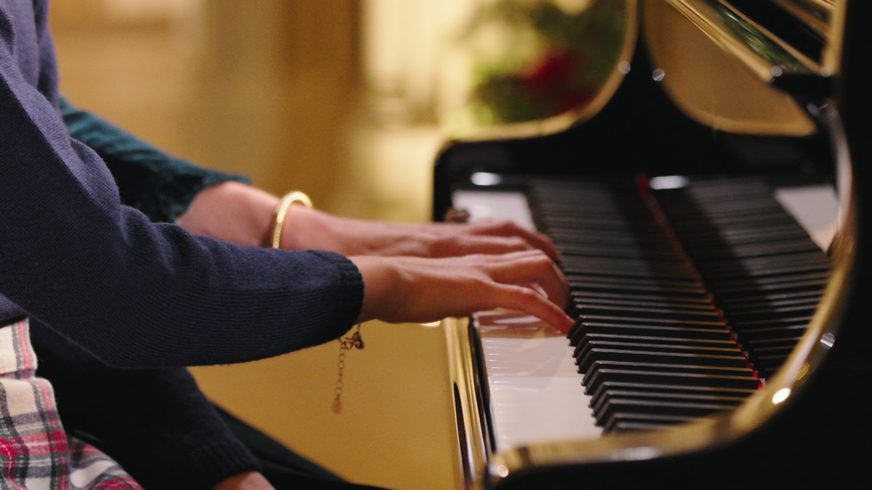 Two arms playing a piano