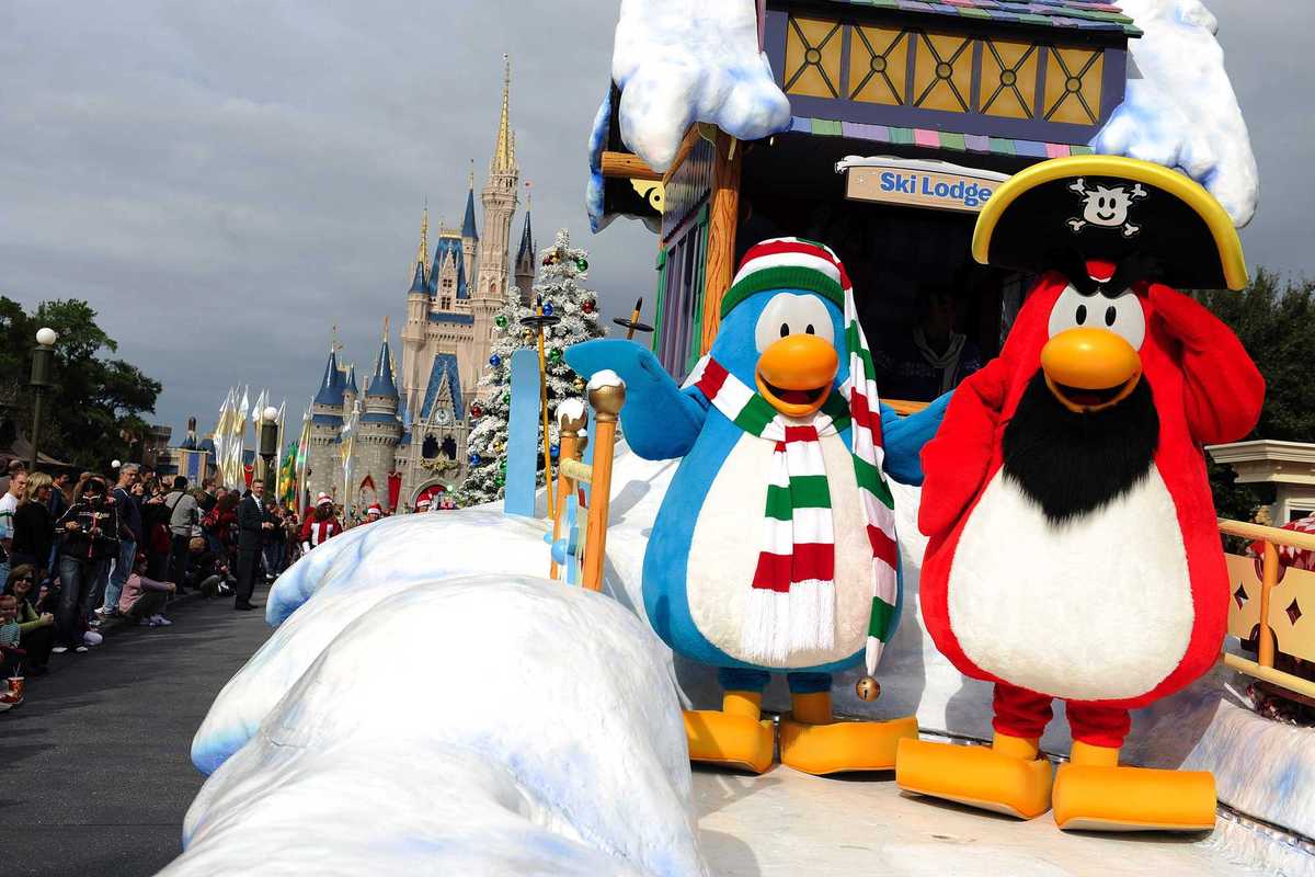 Two Club Penguin mascots on a Disney float.