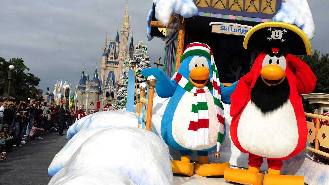 Two Club Penguin mascots on a Disney float.
