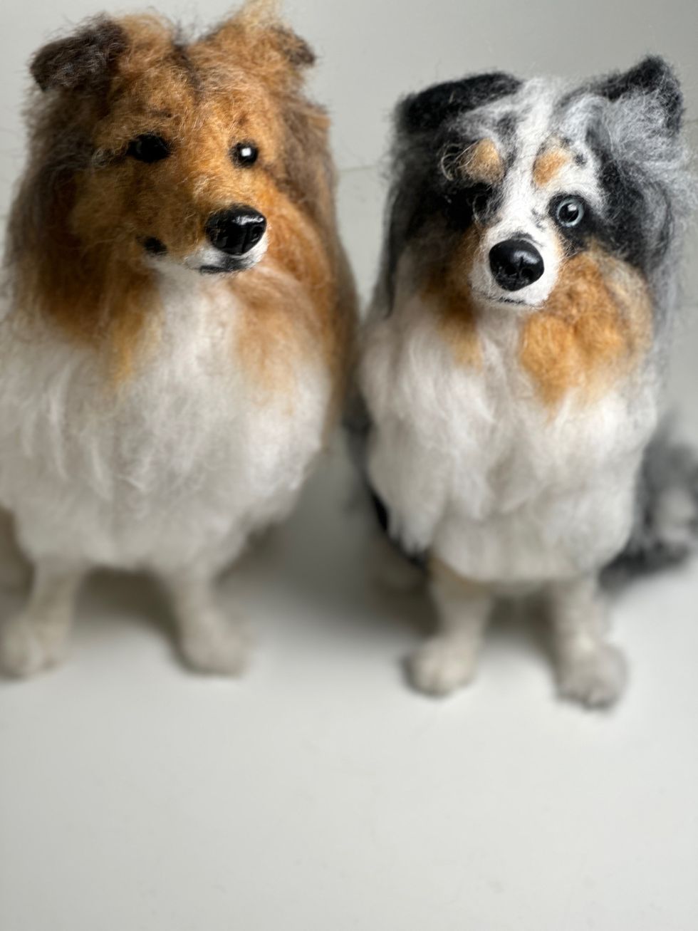 Two dogs created using wool