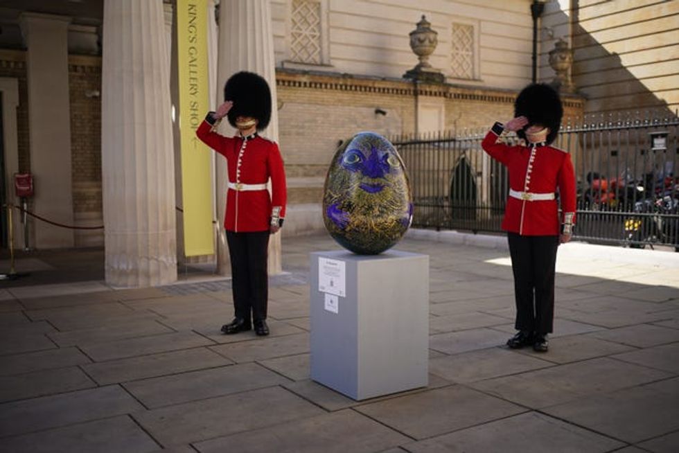 Two guardsmen with the egg