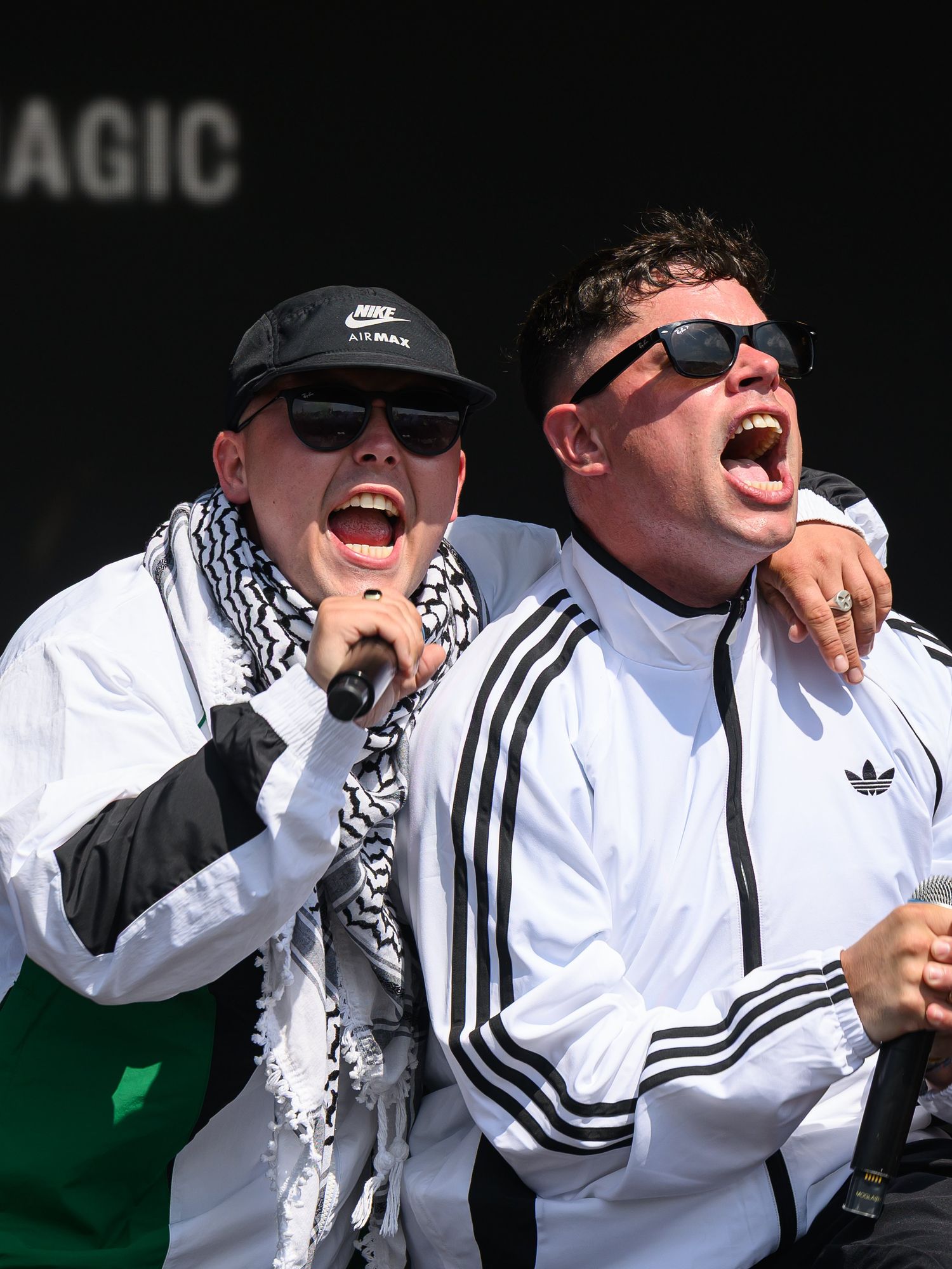 Two members of the Irish rap trio Kneecap performing on the West Holts stage at Glastonbury.
