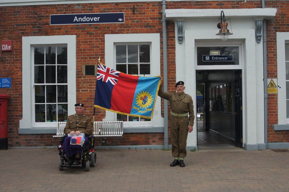 Two men holding a flag