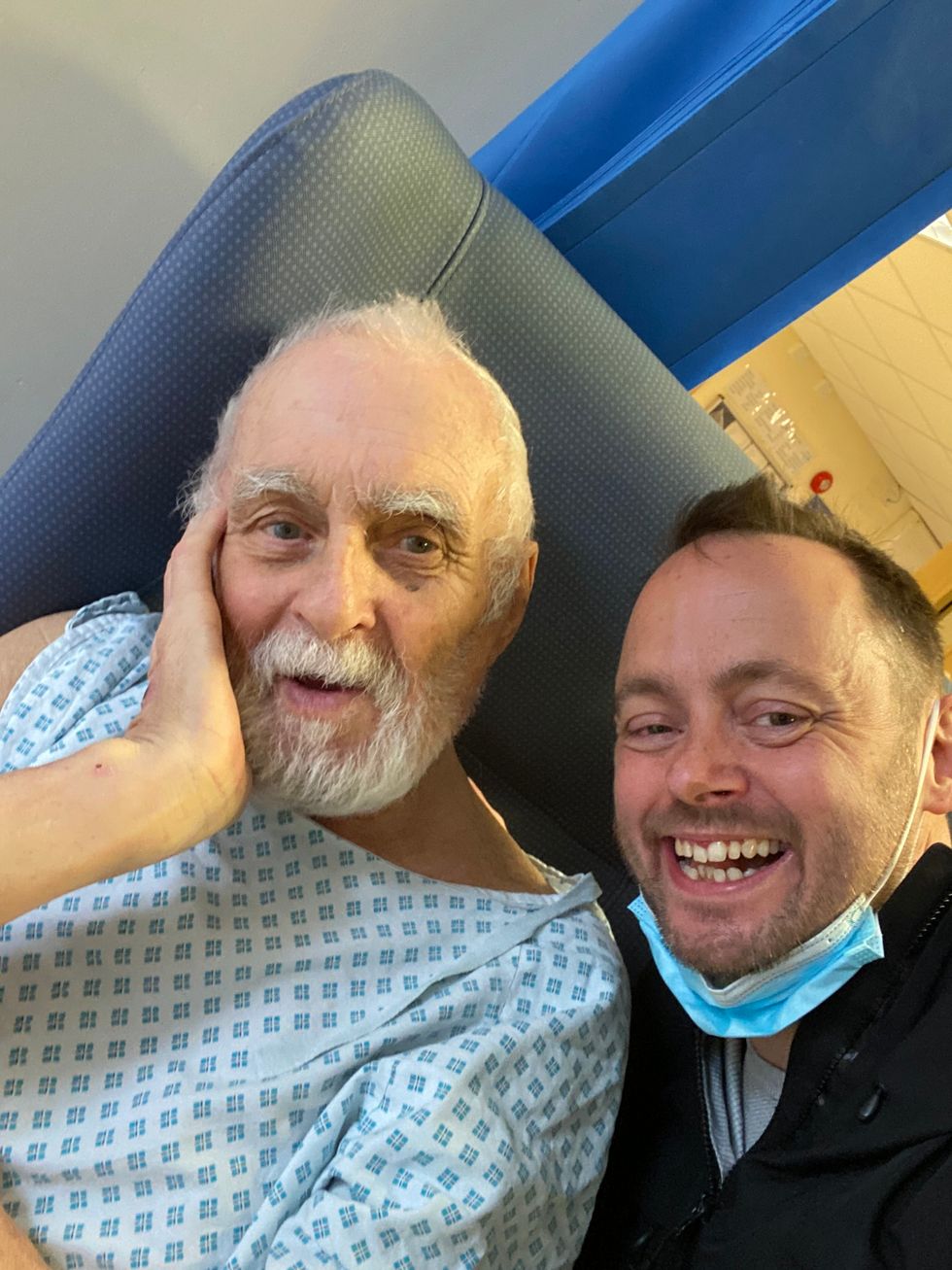 Two men sitting next to each other