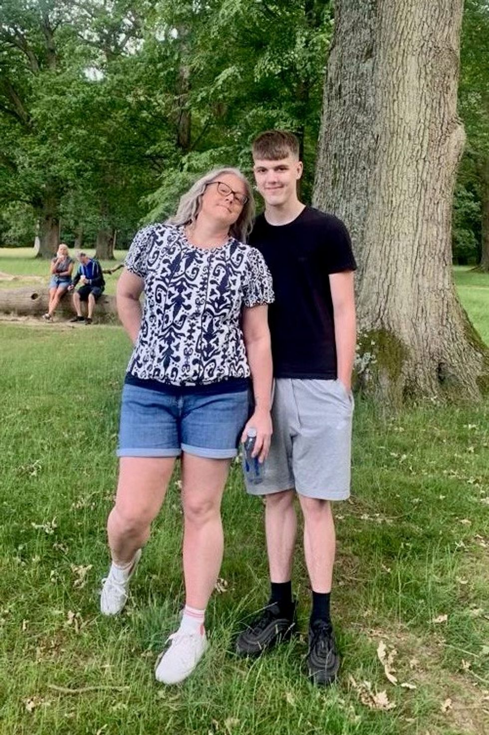 Two people standing next to each other