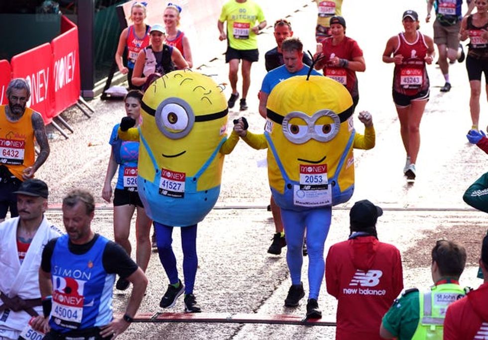 Two runners dressed as Minions finish the London Marathon in 2021