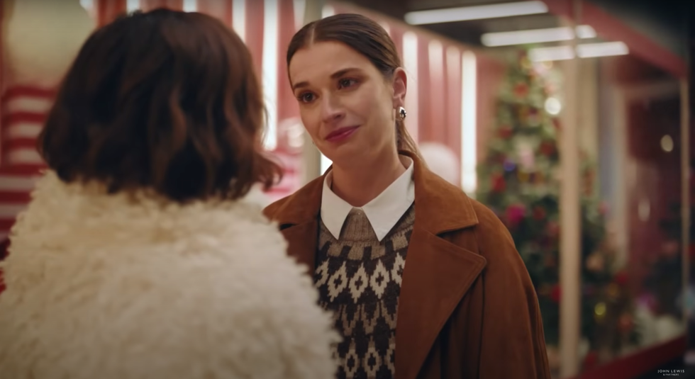 Two sisters standing outside the Oxford Street John Lewis shop